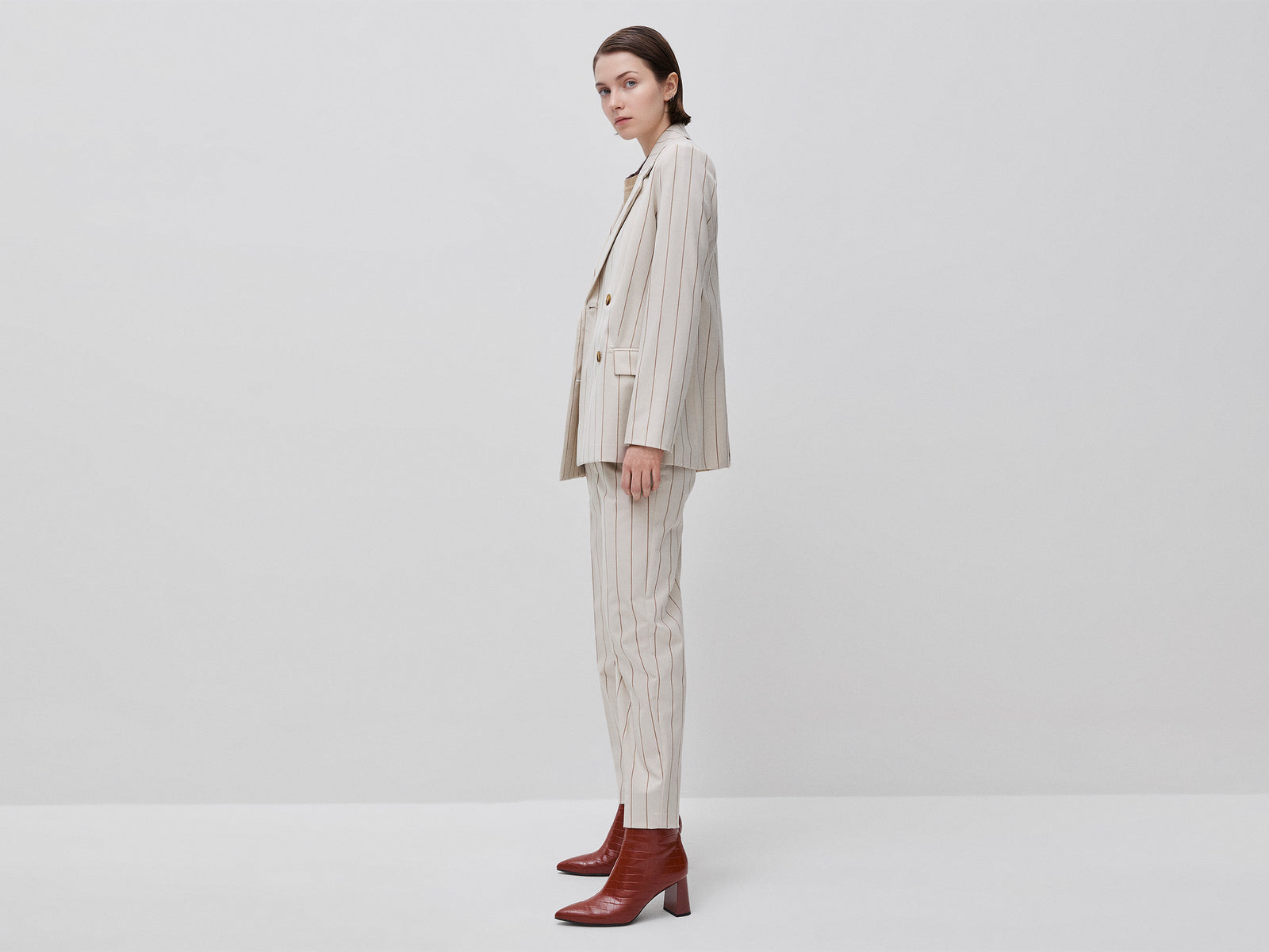 Carrot-fit pinstriped trousers