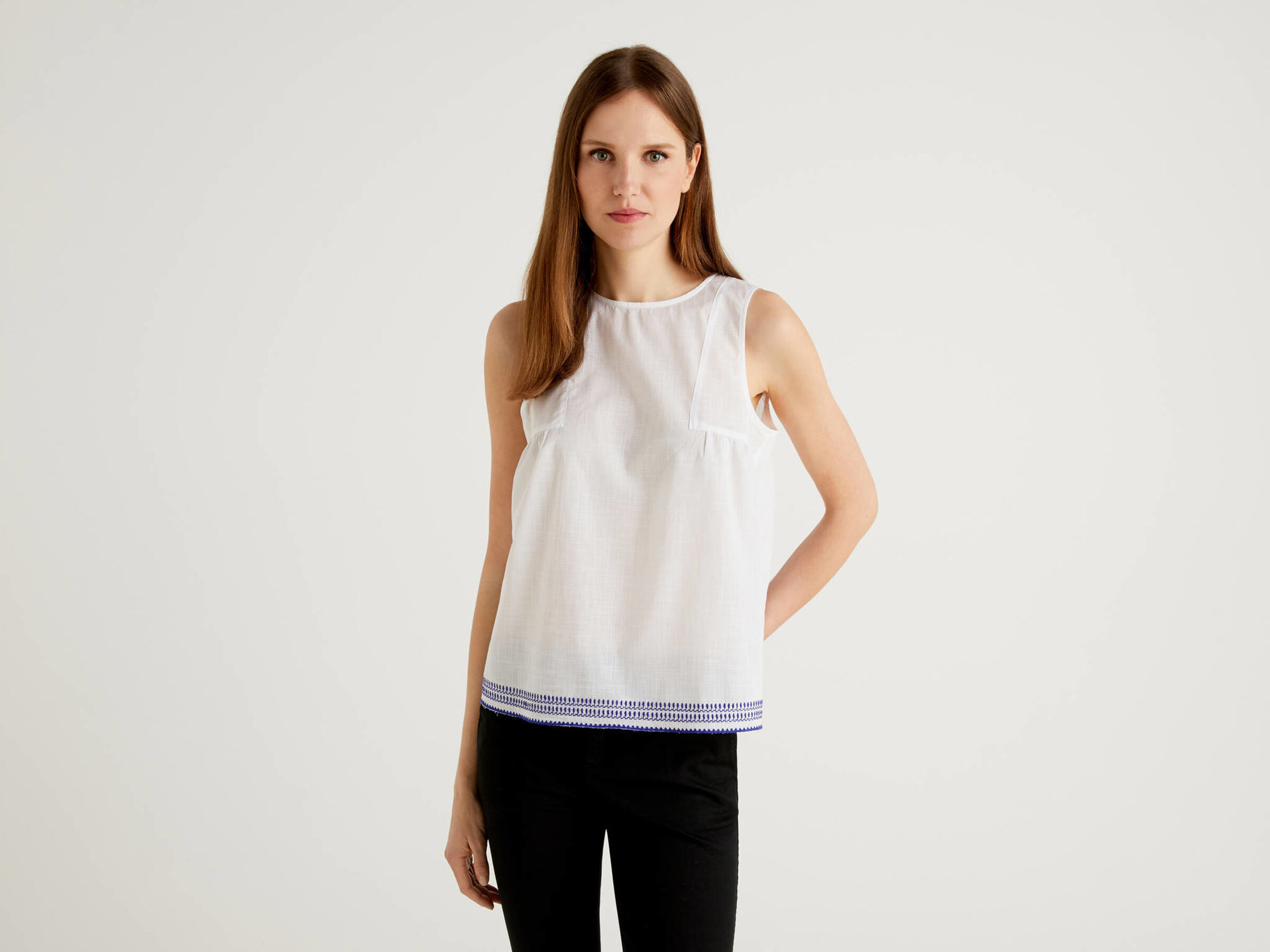 Sleeveless top with embroidered bottom