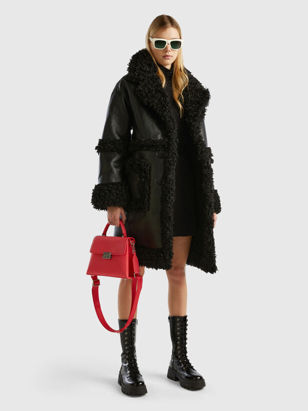 Coat in imitation leather with faux fur