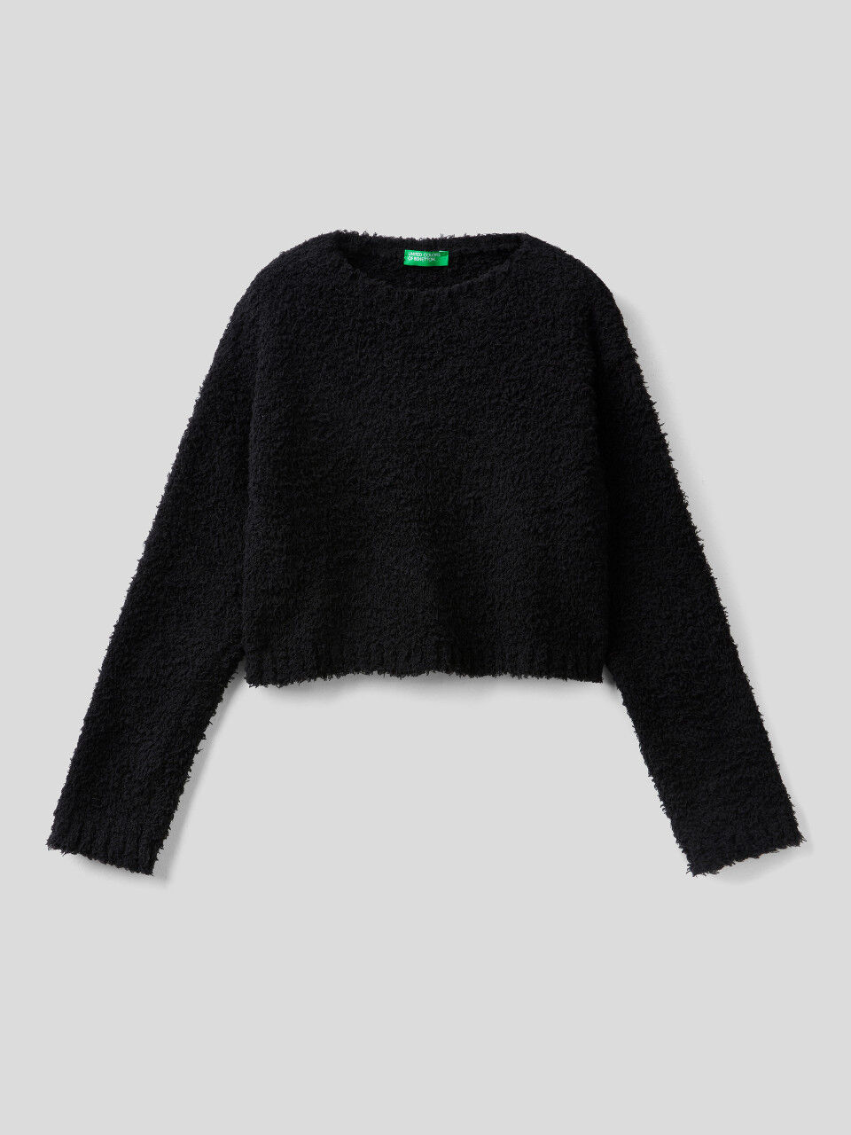 Cropped black sweater with bouclé look