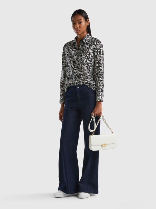 Black shirt with white polka dots