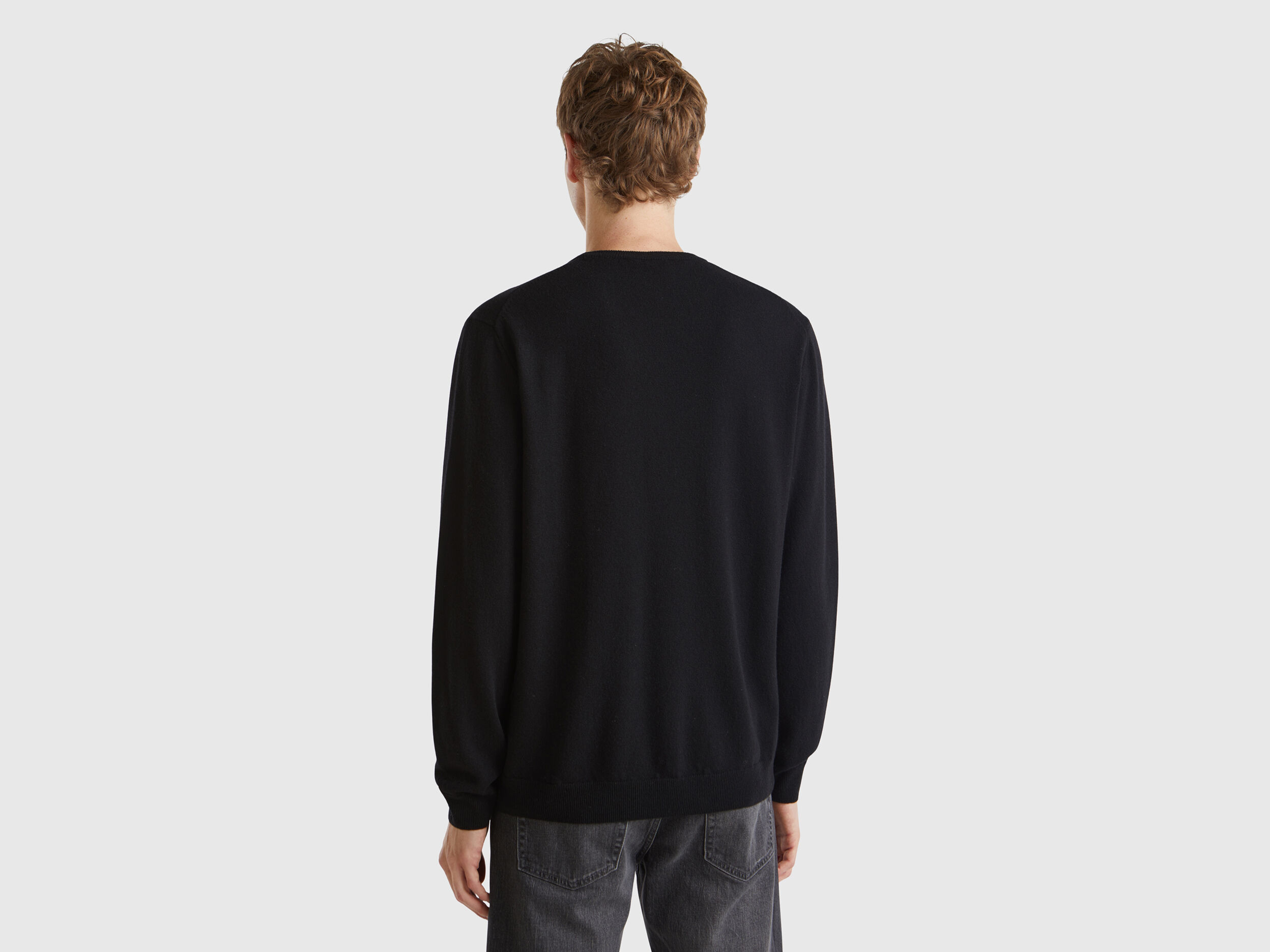Black crew neck sweater in pure Merino wool Black Benetton