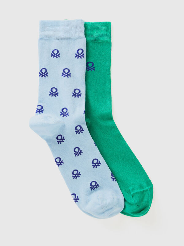 Two pairs of long socks with logos