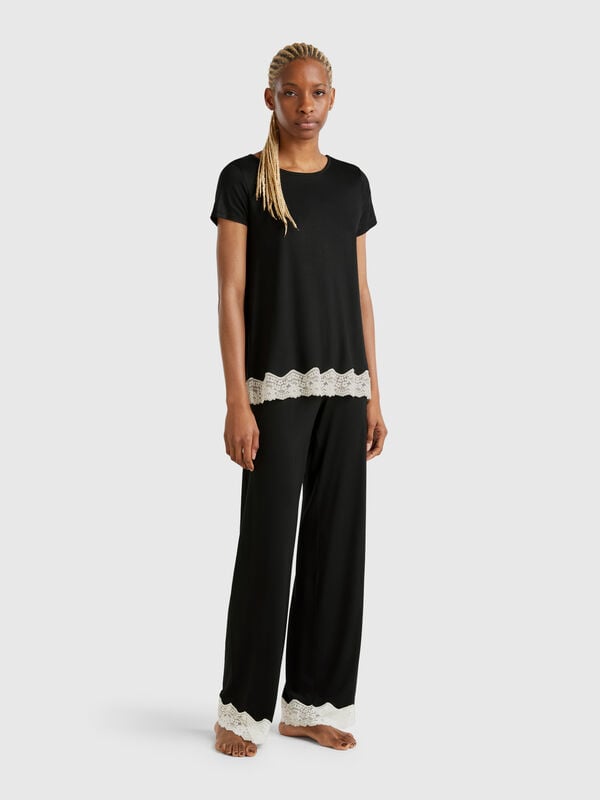 Pantalon fluide avec détails en dentelle Femme